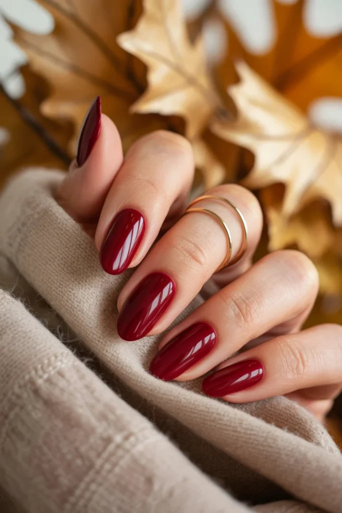 29 November Nail Ideas for the Coziest Fall Manicure 5 Glossy Cranberry Almond Nails